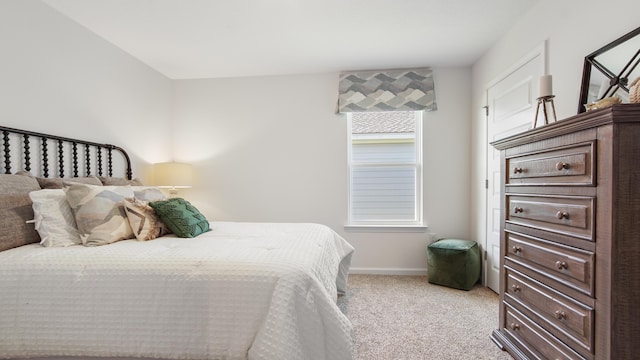 bedroom featuring light carpet