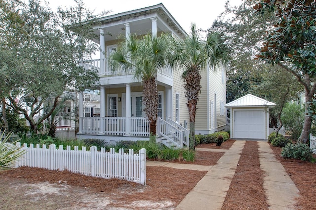 view of front of property with an outbuilding, covered porch, and a garage