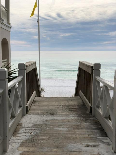 exterior space featuring a beach view and a water view