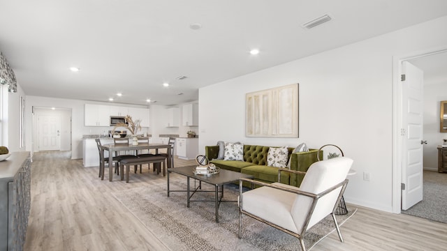 living room featuring light wood-type flooring