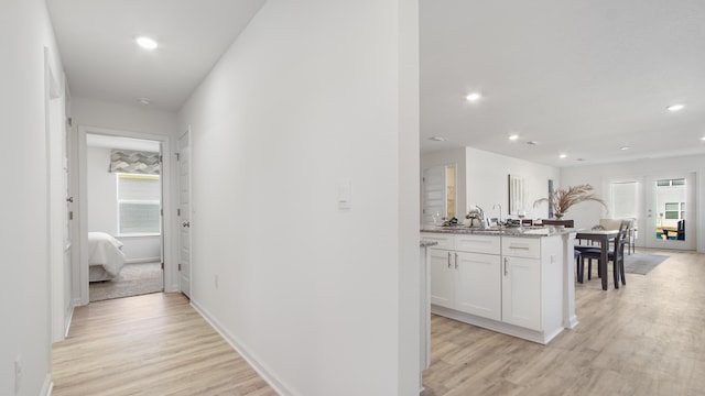 hallway with light wood-type flooring