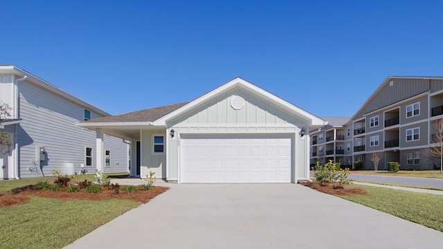 view of front of home with a front lawn and a garage