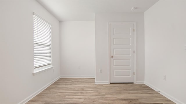 spare room with light hardwood / wood-style flooring