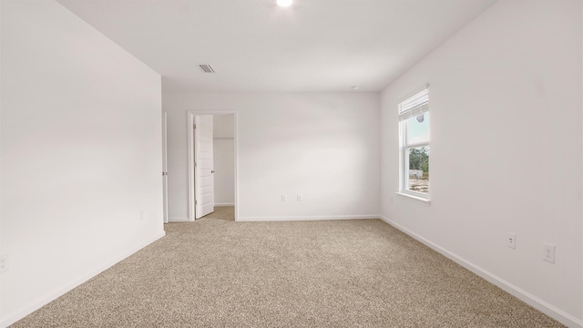 unfurnished room with carpet flooring