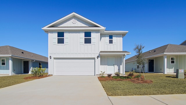 view of front of house featuring a front yard and a garage