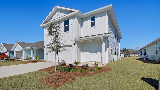 view of front of home featuring a front lawn and a garage