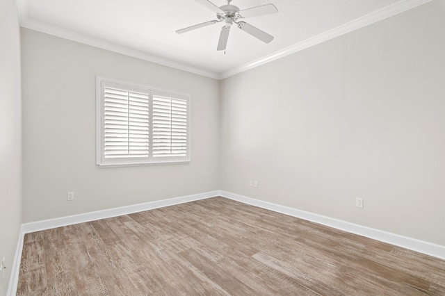 spare room featuring crown molding, ceiling fan, and light wood-type flooring