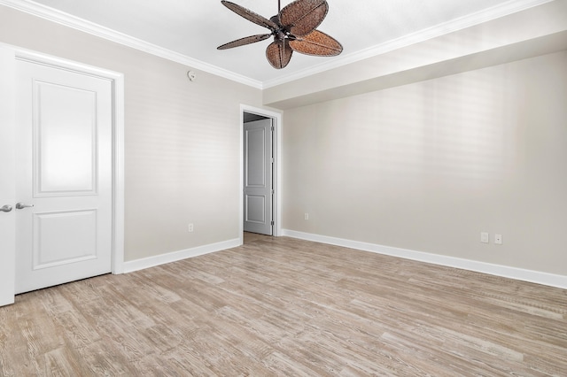 spare room featuring ceiling fan, light hardwood / wood-style floors, and ornamental molding