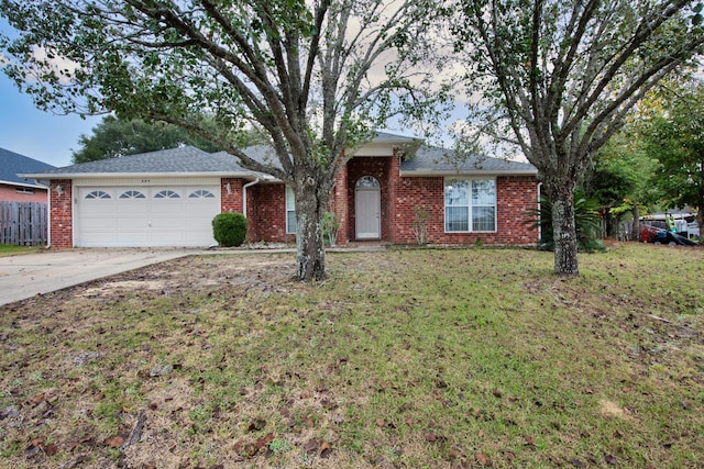 664 Brunson St, Crestview, FL 32536 - ranch-style house with a garage, driveway, and brick siding