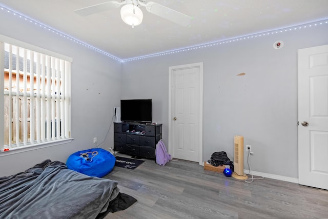 bedroom with hardwood / wood-style flooring and ceiling fan