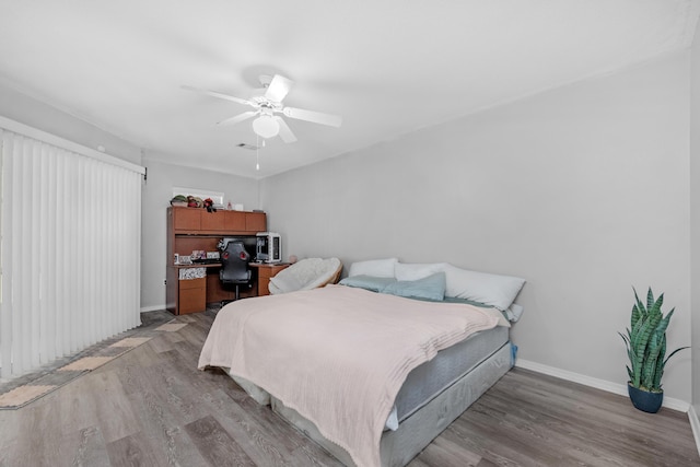 bedroom featuring light wood-type flooring and ceiling fan