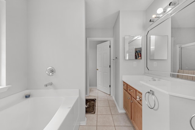 664 Brunson St, Crestview, FL 32536 - full bathroom featuring vanity, a garden tub, tile patterned flooring, and a shower with door