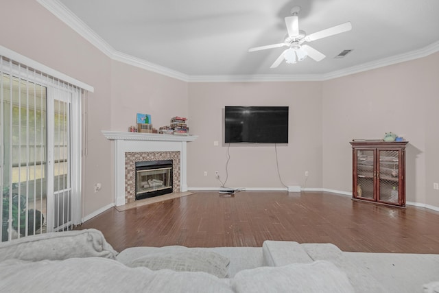 living room with crown molding, ceiling fan, and dark wood-type flooring