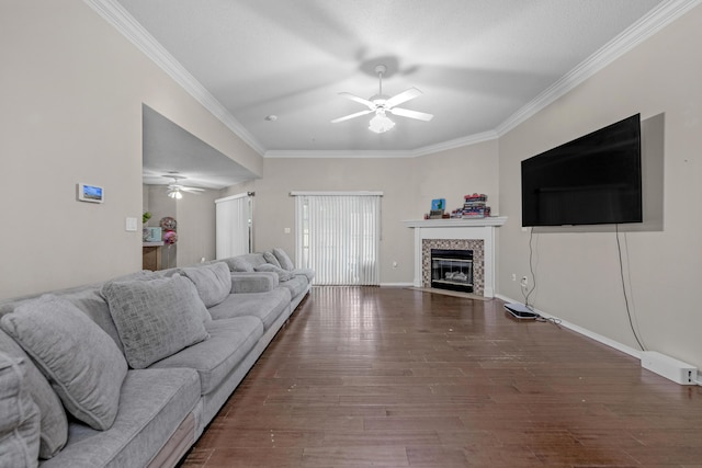 living room with ceiling fan, dark hardwood / wood-style floors, and ornamental molding