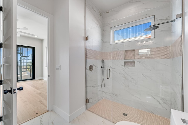 bathroom with walk in shower, a wealth of natural light, and hardwood / wood-style flooring