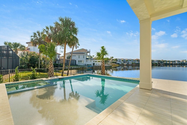 view of pool featuring a patio area and a water view