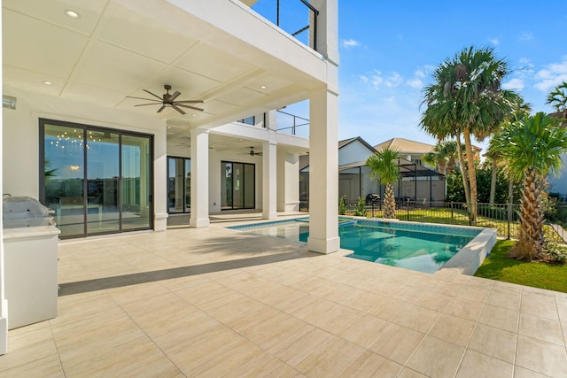 view of swimming pool with ceiling fan and a patio area