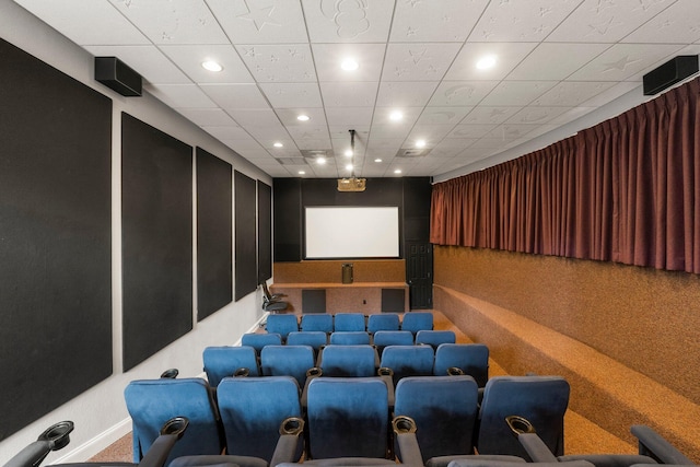 cinema room featuring a drop ceiling