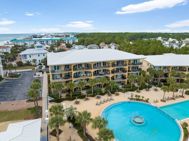 view of swimming pool with a water view