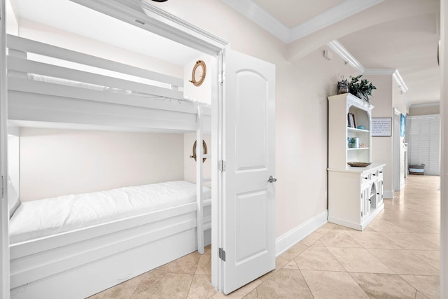 tiled bedroom featuring ornamental molding