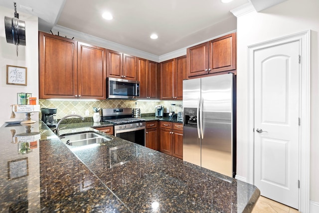 kitchen featuring sink, crown molding, decorative backsplash, light tile patterned floors, and stainless steel appliances