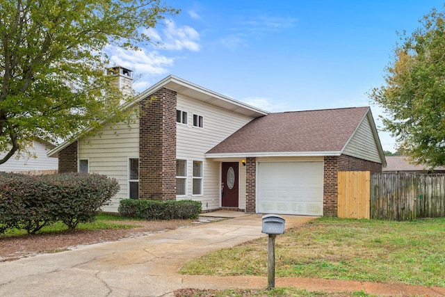 view of front facade with a garage and a front lawn