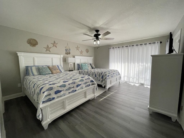 bedroom with a textured ceiling, ceiling fan, and dark hardwood / wood-style floors