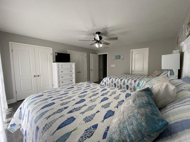 bedroom featuring two closets and ceiling fan