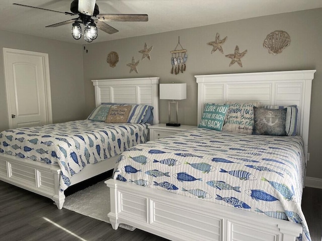 bedroom featuring ceiling fan and dark hardwood / wood-style floors