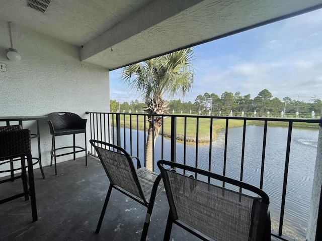 balcony featuring a water view