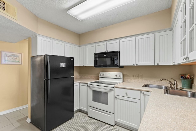 kitchen with white cabinets, a textured ceiling, sink, and black appliances