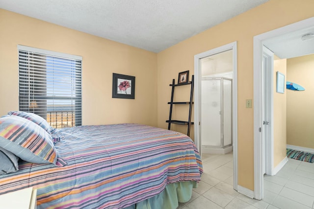 tiled bedroom featuring a textured ceiling