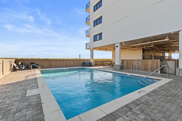 view of swimming pool featuring a patio