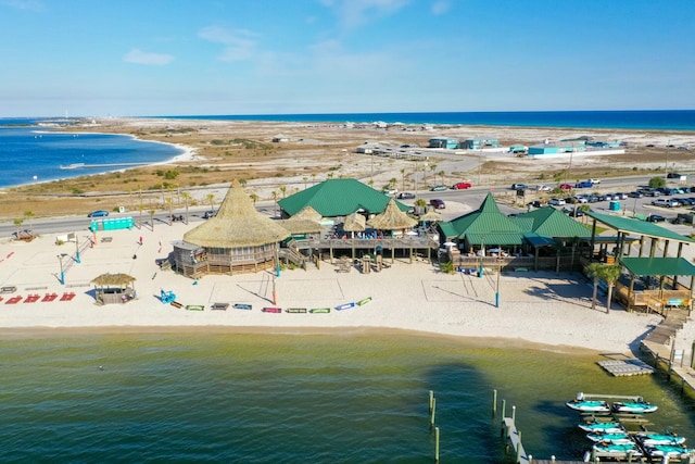 aerial view with a water view and a view of the beach