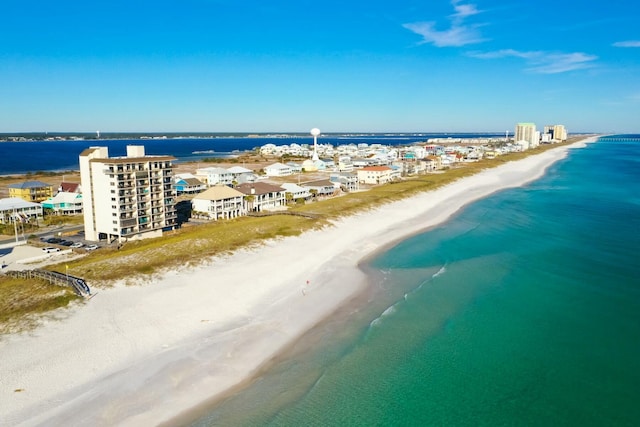 bird's eye view featuring a view of the beach and a water view