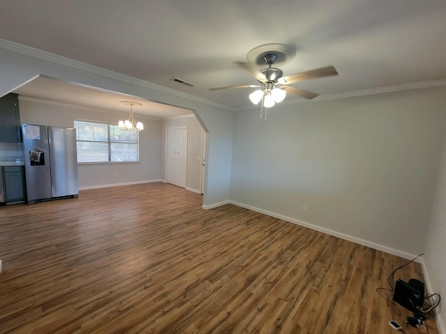 unfurnished living room with crown molding, ceiling fan with notable chandelier, and hardwood / wood-style flooring