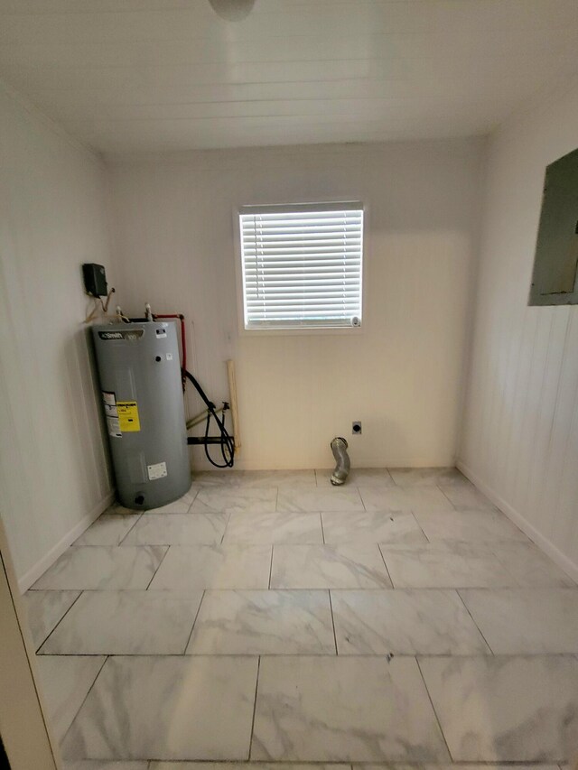 utility room featuring electric panel and water heater