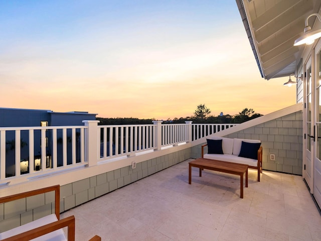 view of patio terrace at dusk