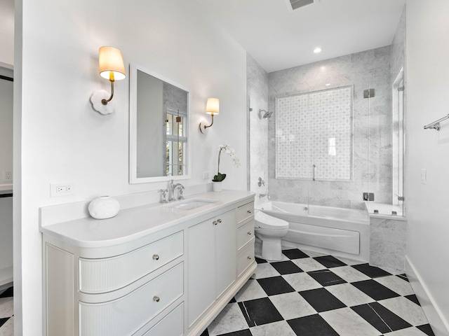 full bathroom with toilet, tiled shower / bath, and vanity