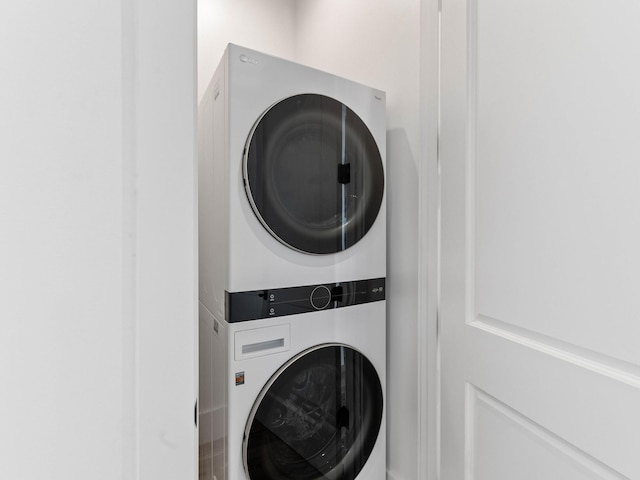 laundry area with stacked washer / drying machine