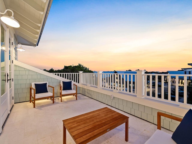 view of patio terrace at dusk