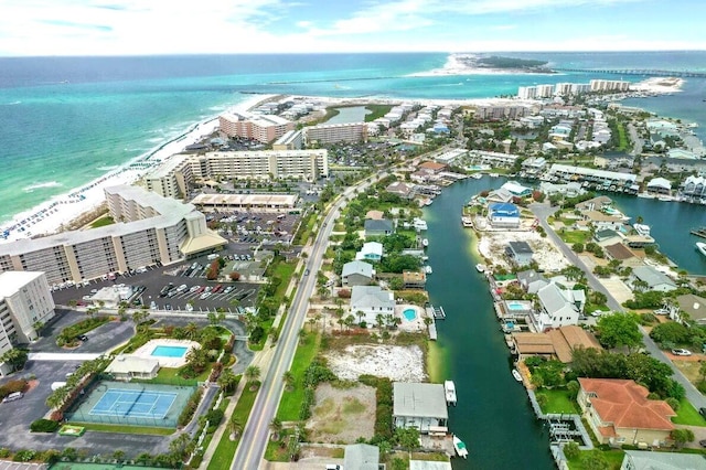 bird's eye view featuring a water view and a view of the beach