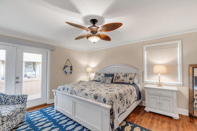 bedroom featuring ceiling fan, dark hardwood / wood-style flooring, and ornamental molding