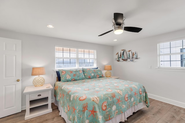 bedroom featuring hardwood / wood-style flooring and ceiling fan