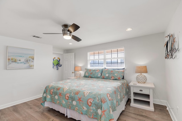 bedroom featuring hardwood / wood-style flooring and ceiling fan