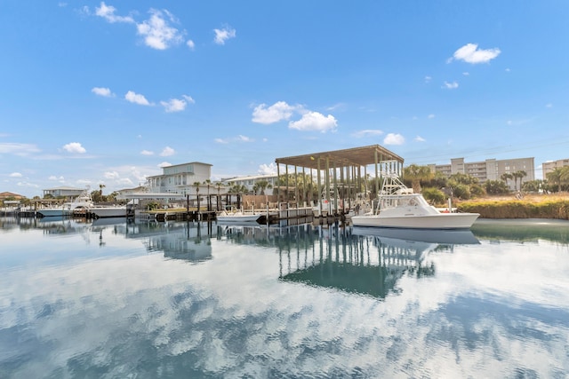 exterior space featuring a boat dock and a water view