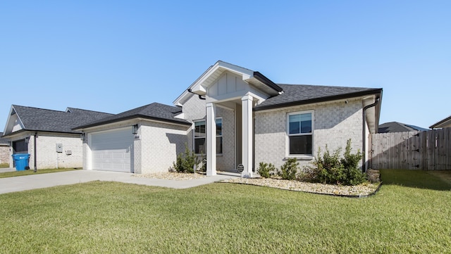 view of front of home featuring a garage and a front yard