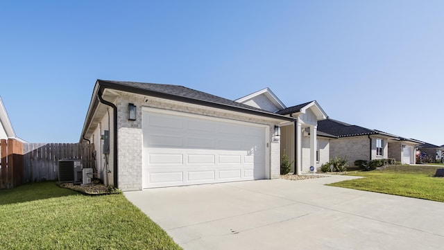 ranch-style home with a front yard, a garage, and central air condition unit