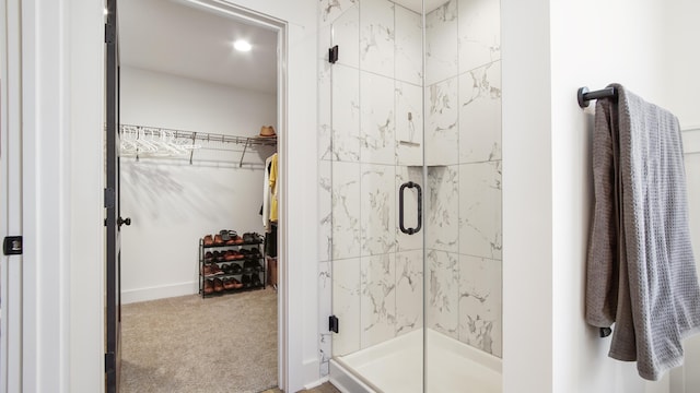 bathroom with a shower with shower door