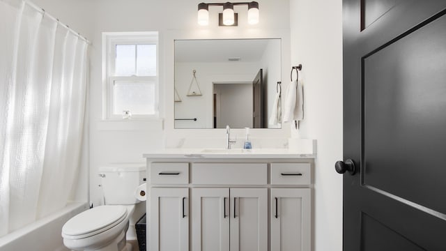 full bathroom featuring vanity, toilet, and shower / bathtub combination with curtain